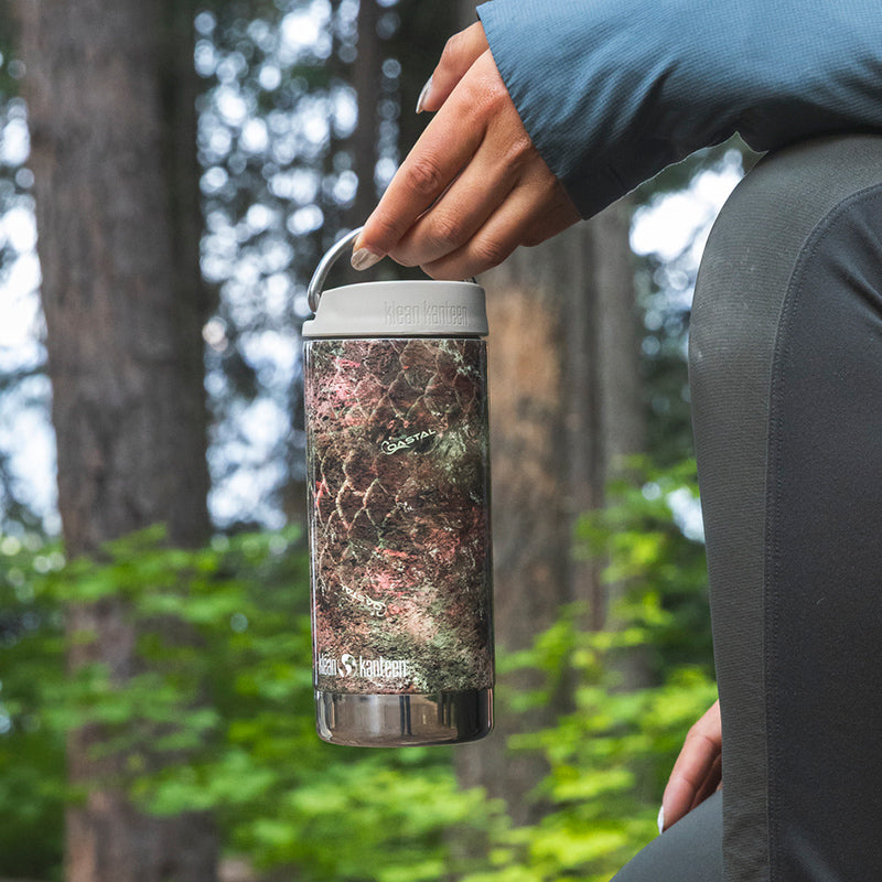 12oz-tkwide-with-twist-cap-mossy-oak-w5 12oz_tumbler_mossyoak_rainbowtrout_hand_closeup_square.jpg